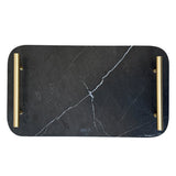 Black marble cutting board with gold handles on a white background